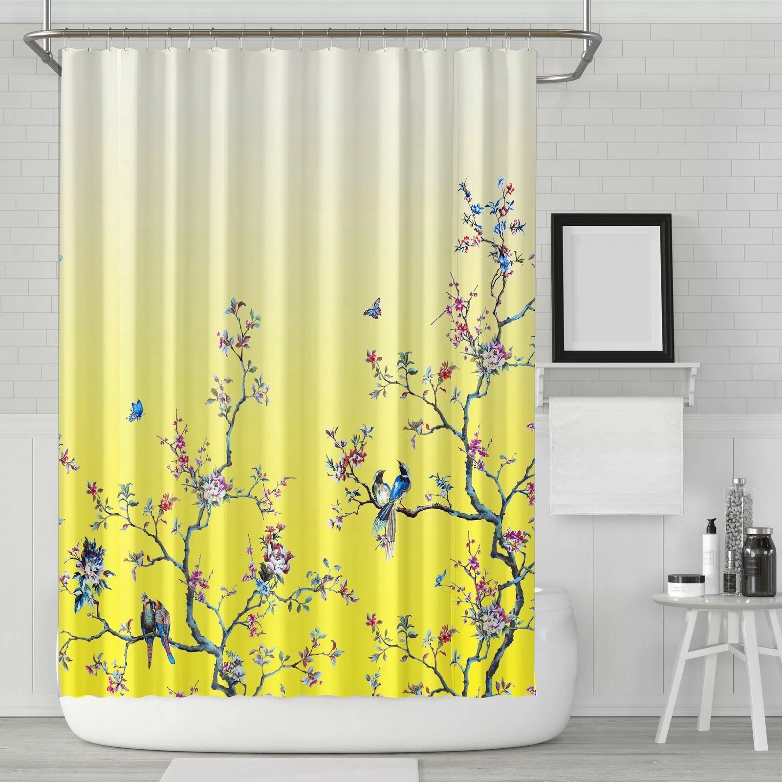 a shower curtain with bird and tree design