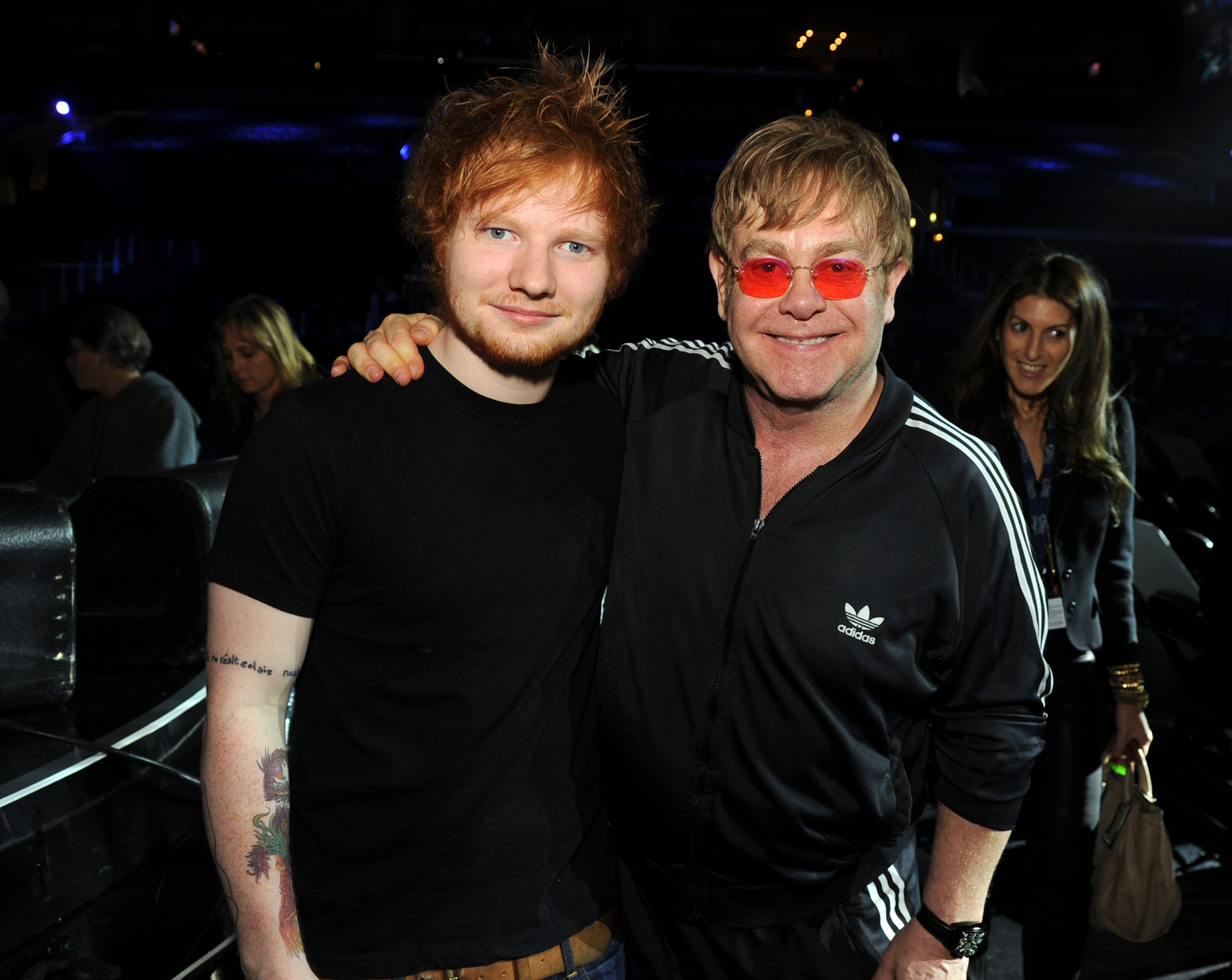 Sheeran and John pose for a photo together at an event