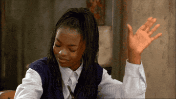 Lauryn Hill in &quot;Sister Act 2: Back in the Habit&quot; raising her hand in praise