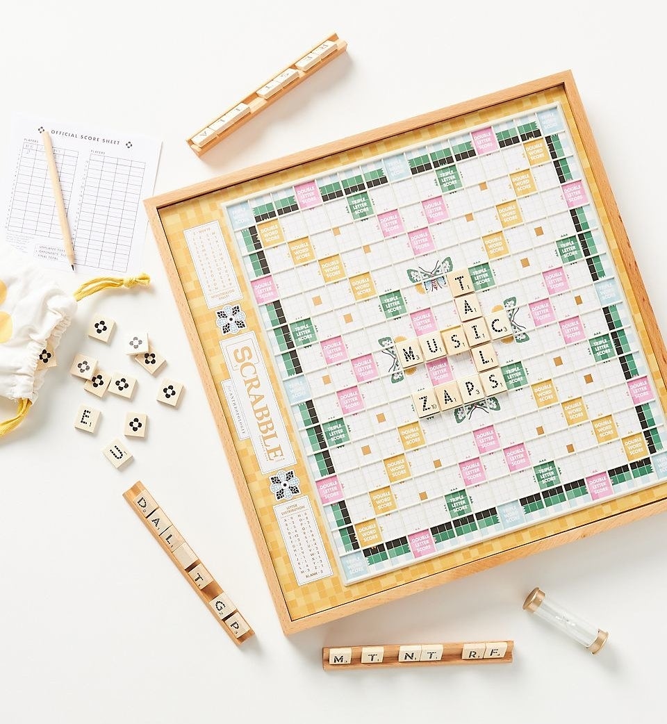 the Scrabble game in yellow, green, and pink