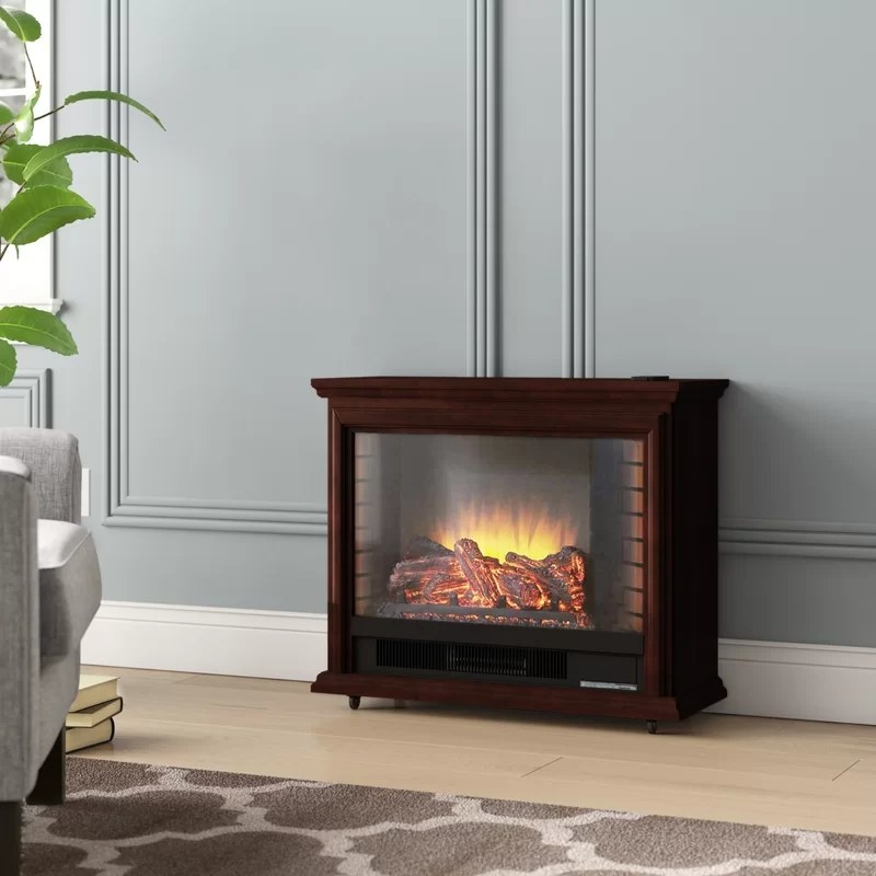 An electric fireplace on wheels in mahogany