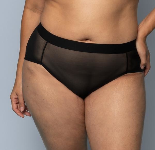 bottom half, model wearing mesh black panties