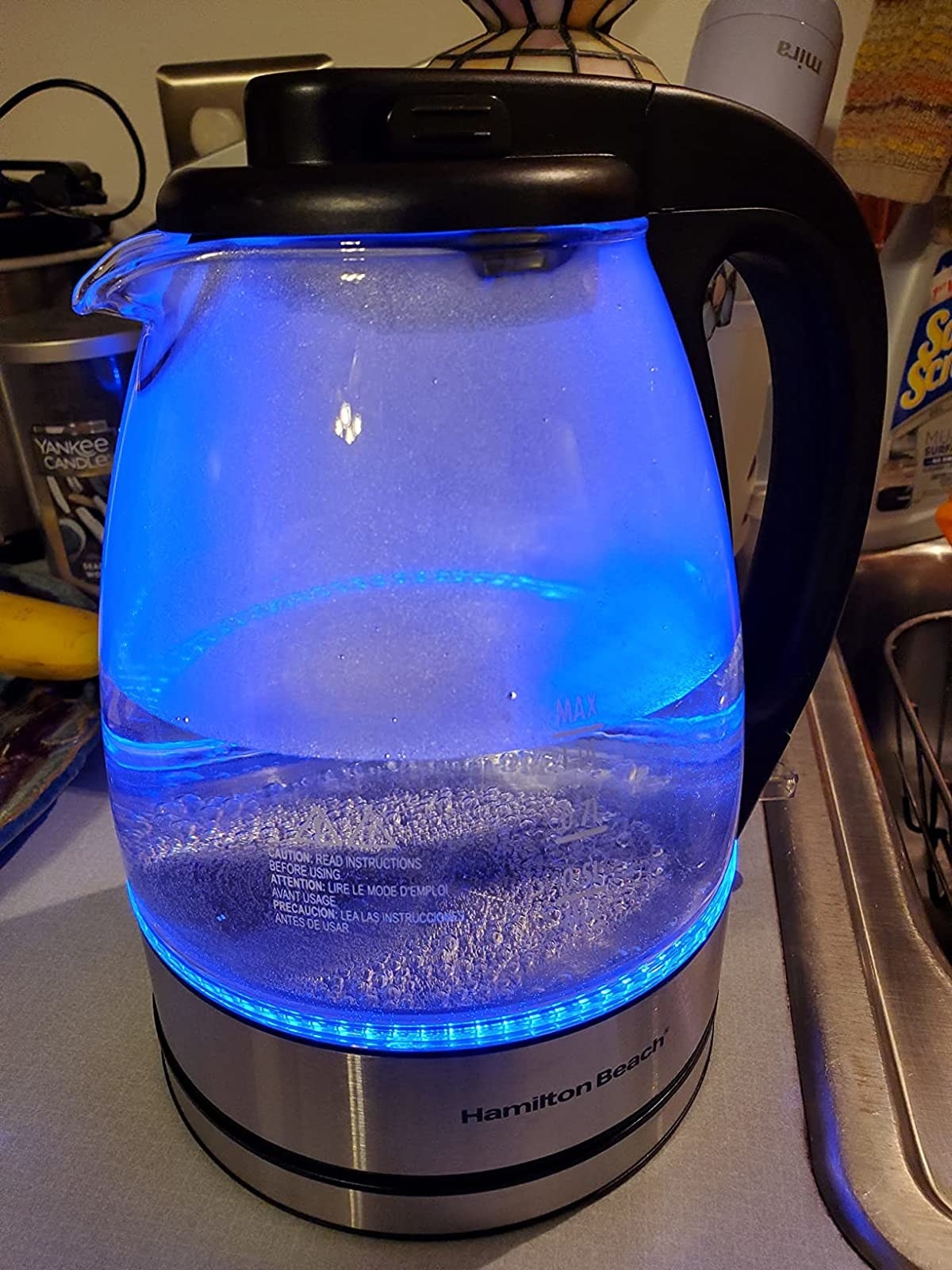 Reviewer&#x27;s image of tea kettle turned on emitting a blue light