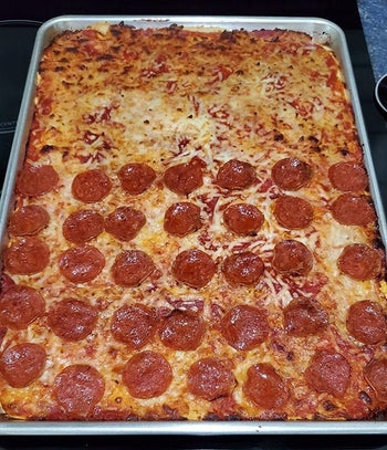Reviewer photo of pizza made in the sheet tray