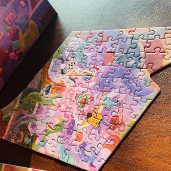 Reviewer photo of a piece of the puzzle in shades of pink, purple, orange, and more