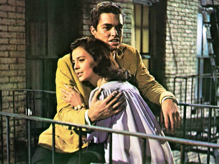 Natalie Wood as Maria embracing a man on balcony