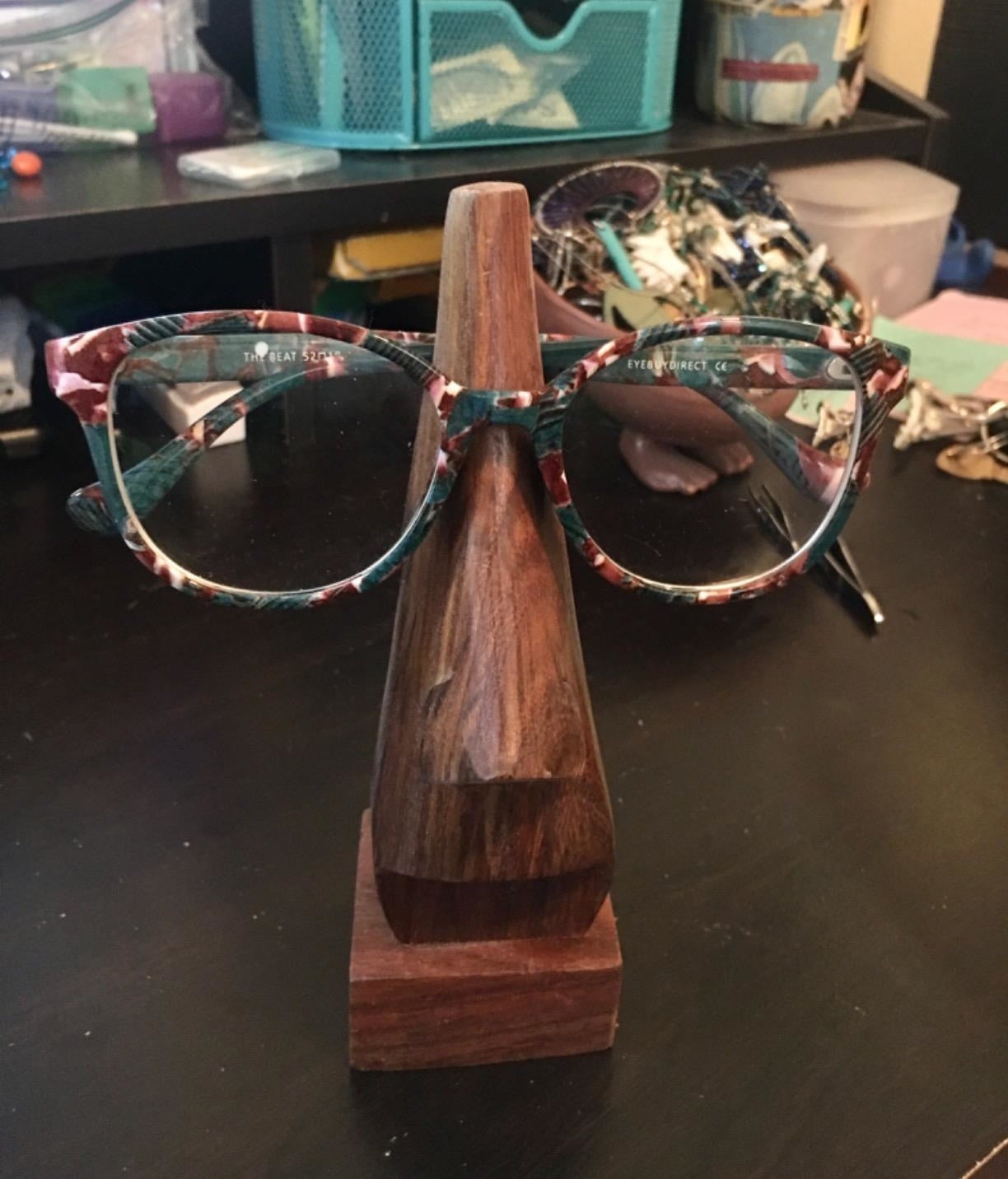 Reviewer photo of the wooden stand with glasses on it