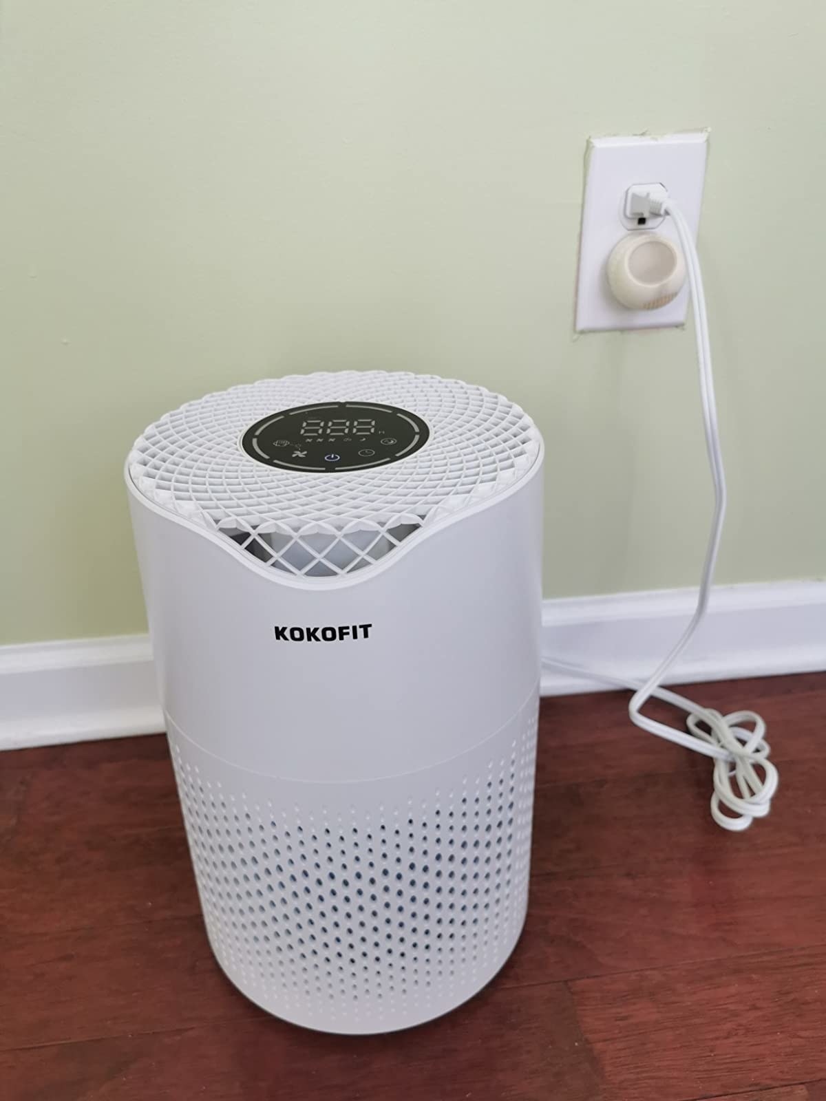 reviewer image of the air purifier plugged in