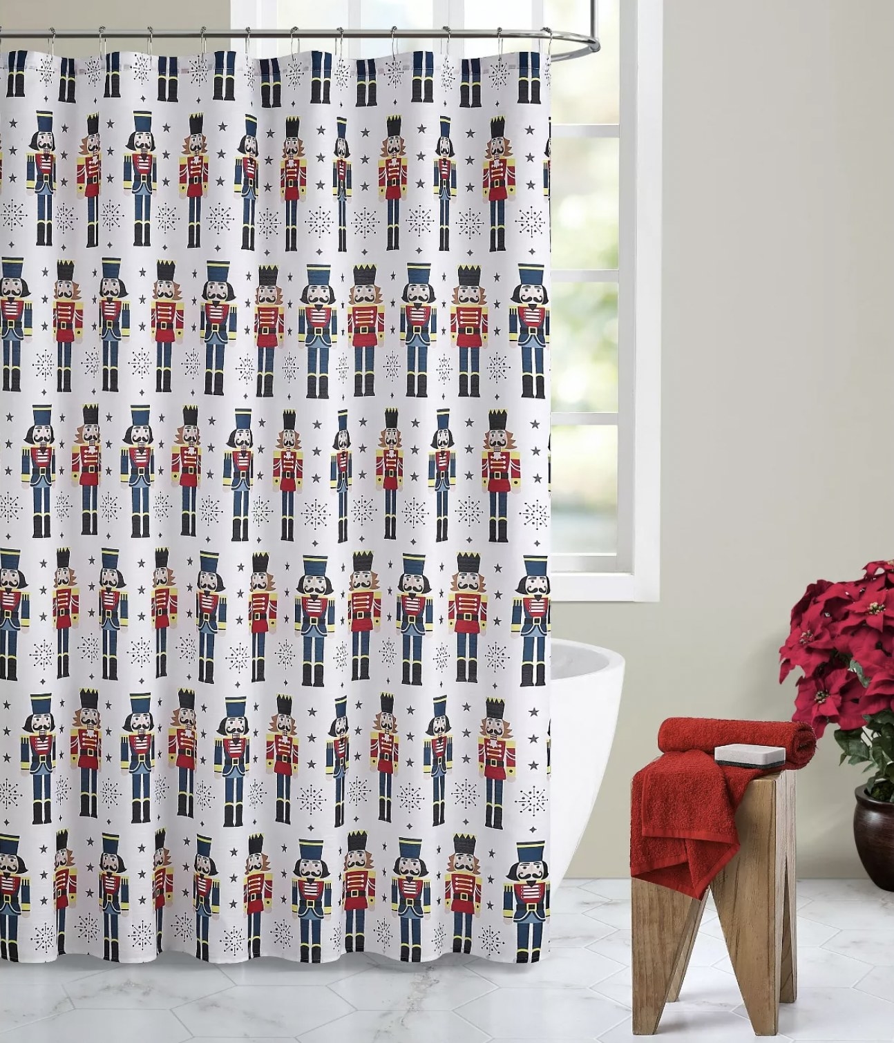 The shower curtain adorned with nutcrackers