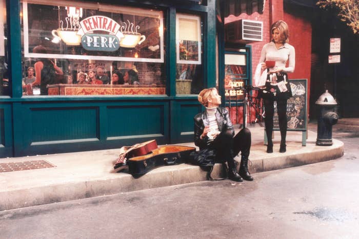 A throwback photo of Jennifer and Lisa Kudrow on the sidewalk outside the coffee shop Central Perk