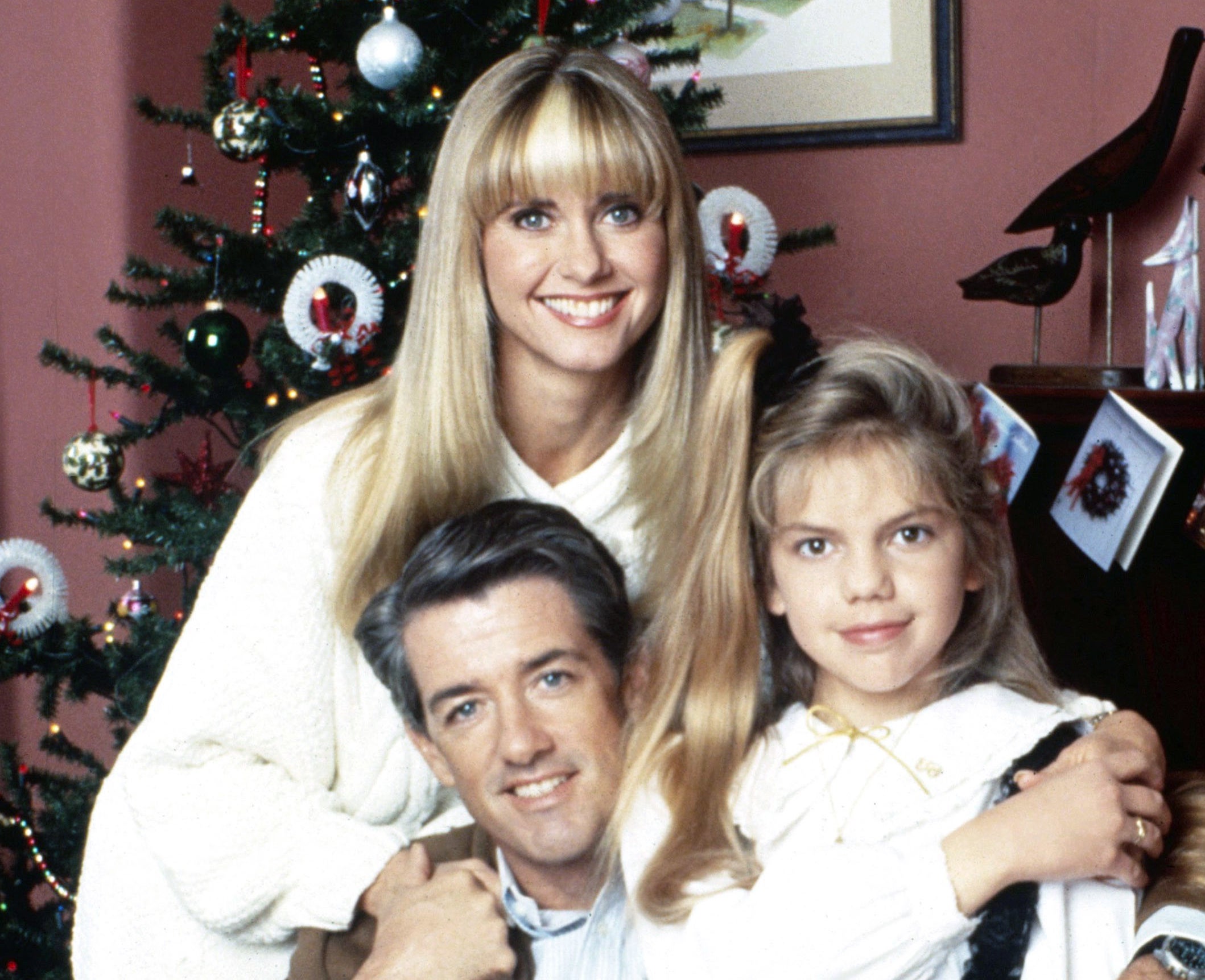 A family poses together for the holidays in "A Mom for Christmas"
