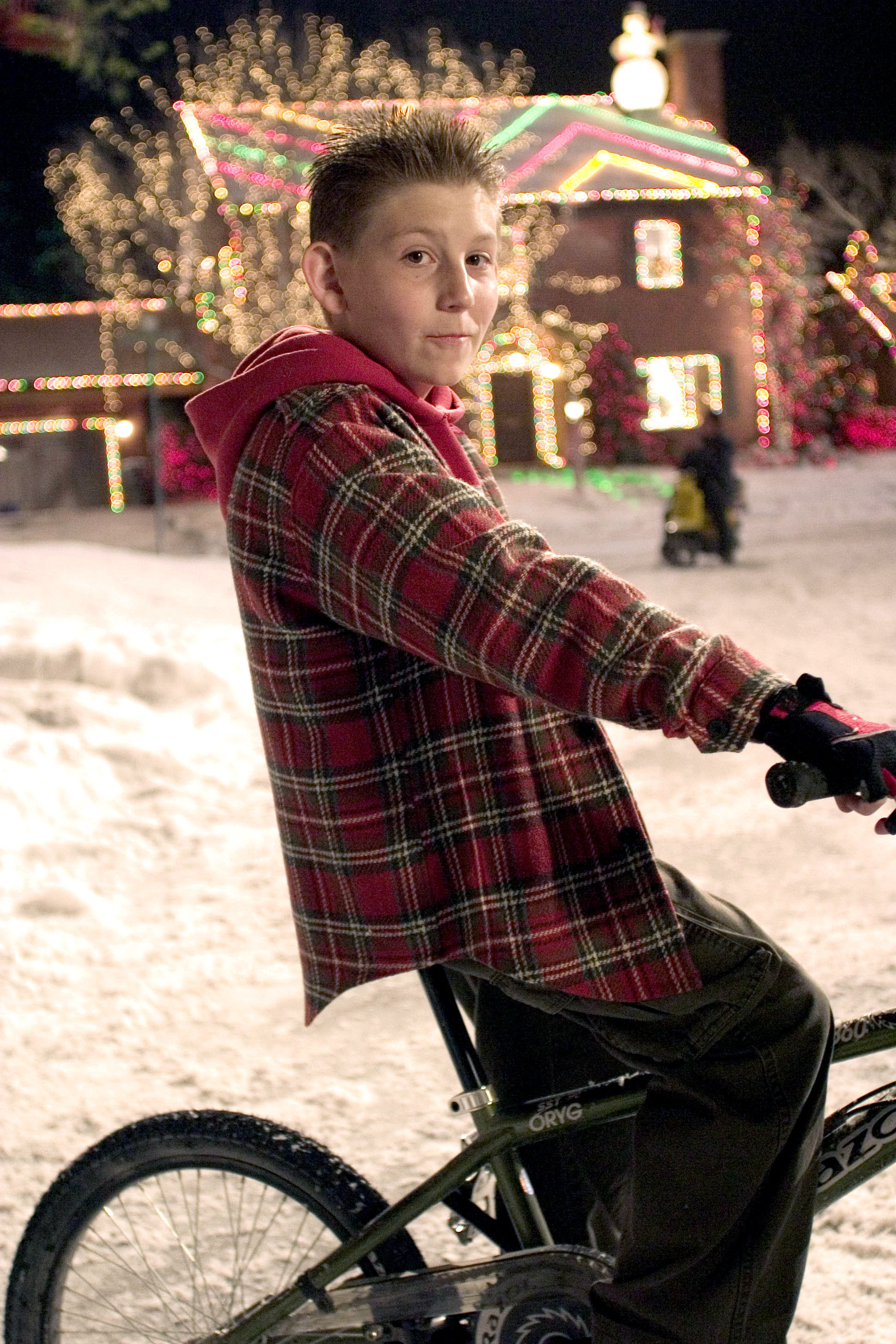 erik is on a bike with spiky hair in the snow