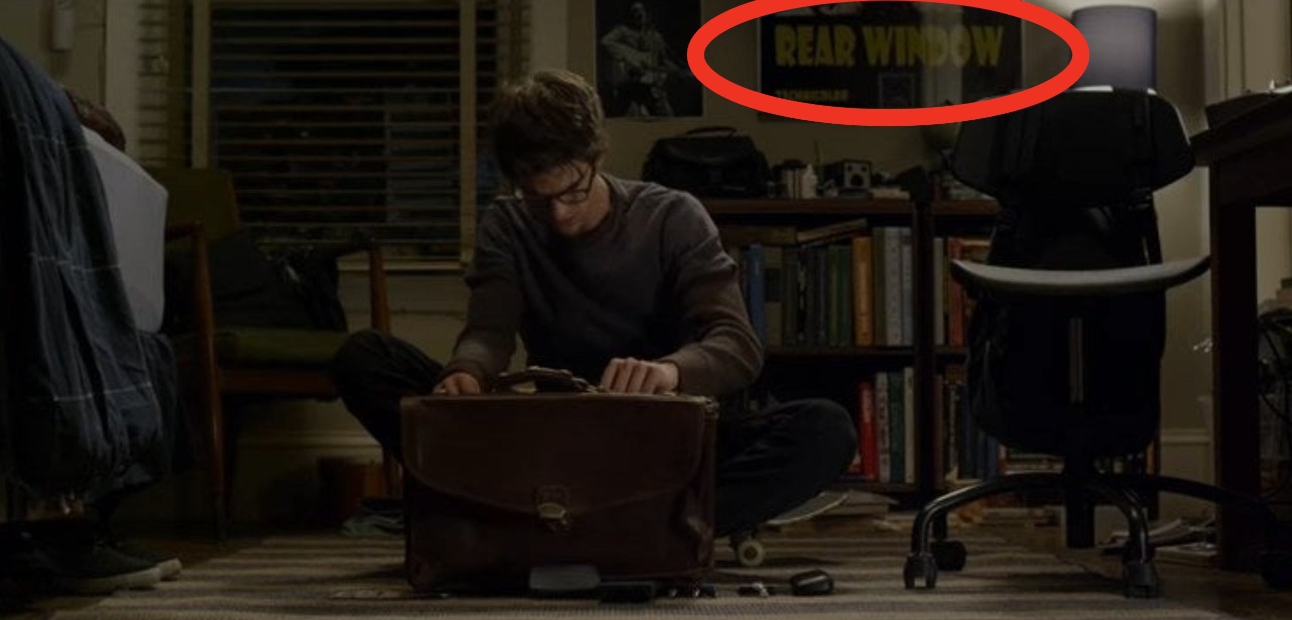 Peter sitting on the floor of his room, looking through his father&#x27;s leather bag, in &quot;The Amazing Spider-Man&quot;
