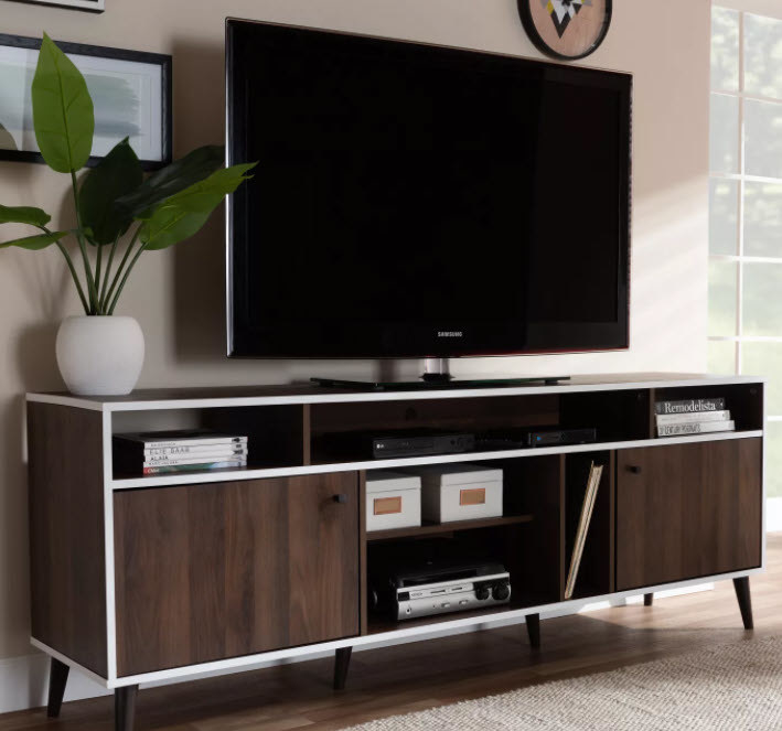 A dark wooden brown TV stand with white borders and 6 legs. Multiple styles of storage space whether it be open cubbies or pull-open door cabinets.