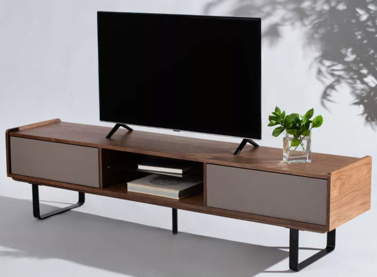 A low standing TV stand/media console with 2 drawers with white doors. one middle shelf and black iron legs.