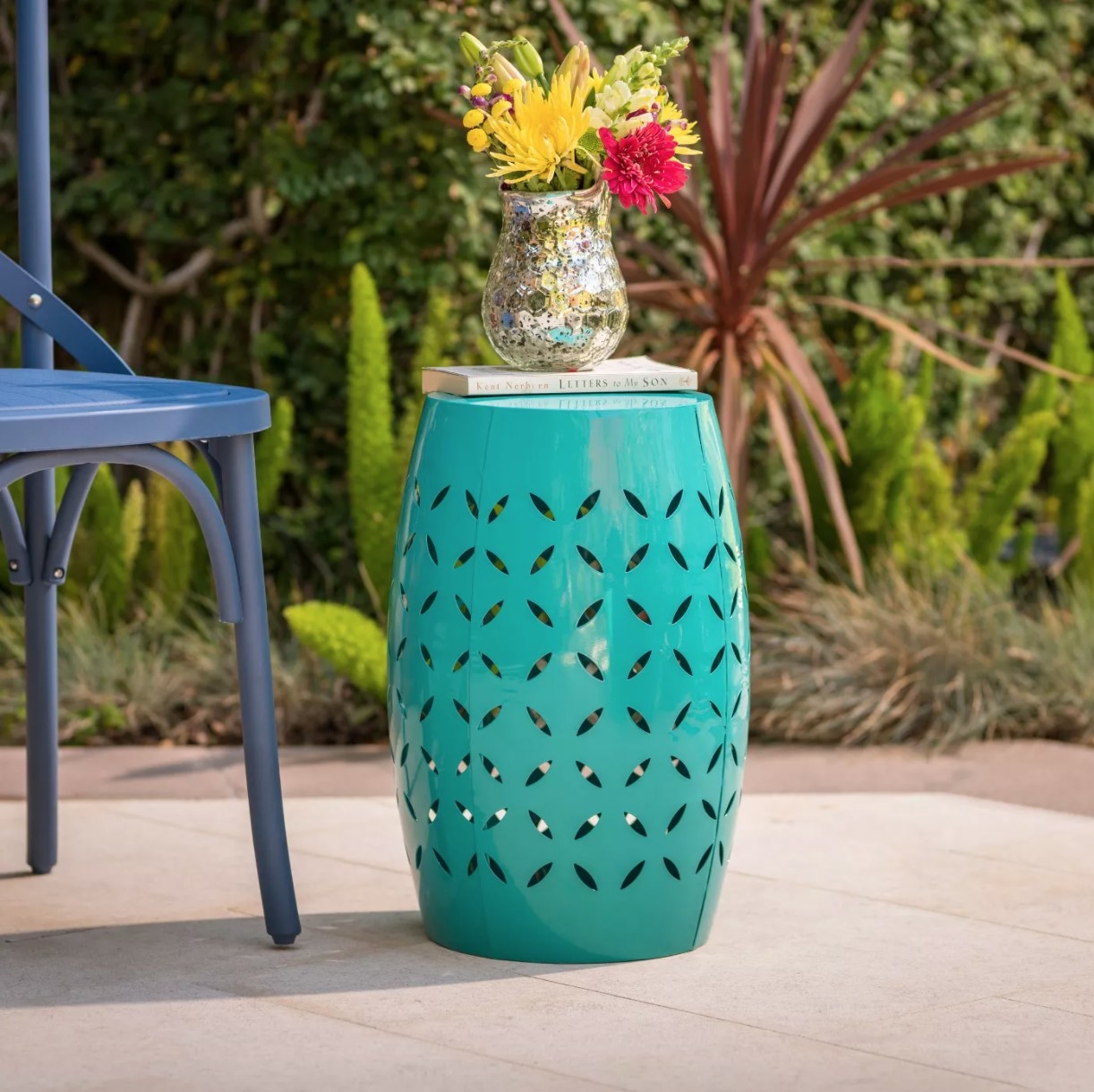 teal drum side table with geometric cut outs