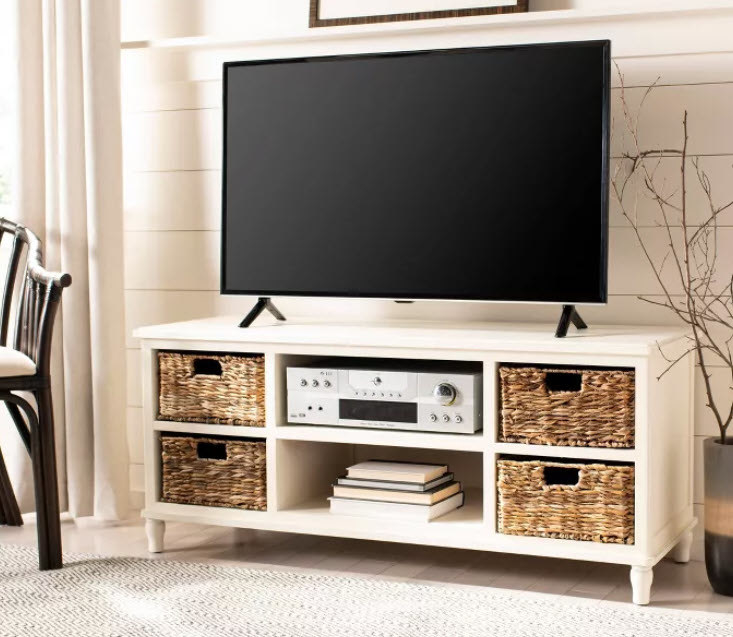 An all-white TV stand with 6 cubbies, 4 of which can hold small wicker baskets (baskets included). Middle shelving included as well. Comes in different colors - White, Black, Cherry, Vintage Gray, and Soft Sky Full.
