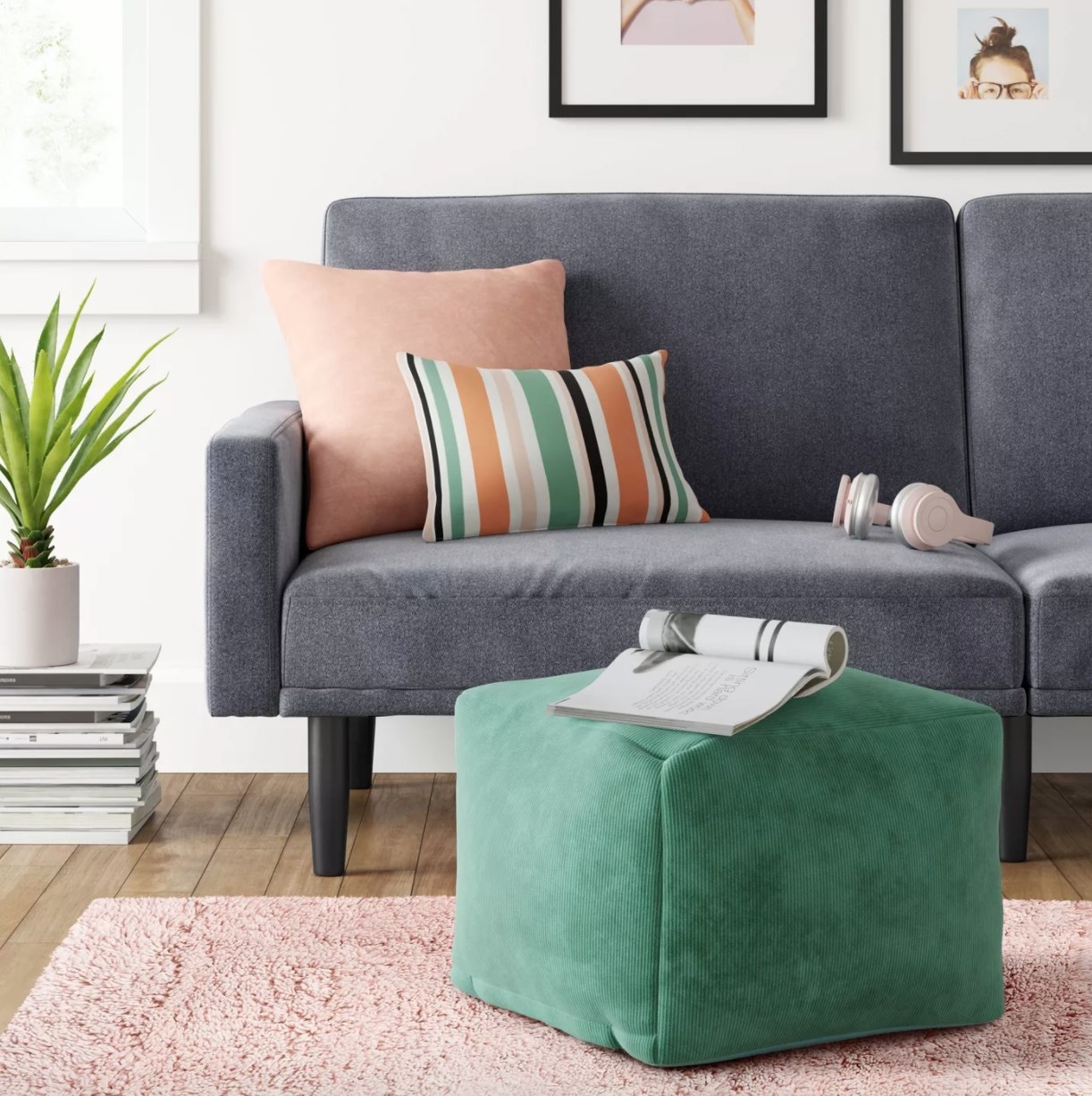 green cube shaped pouf in a living room