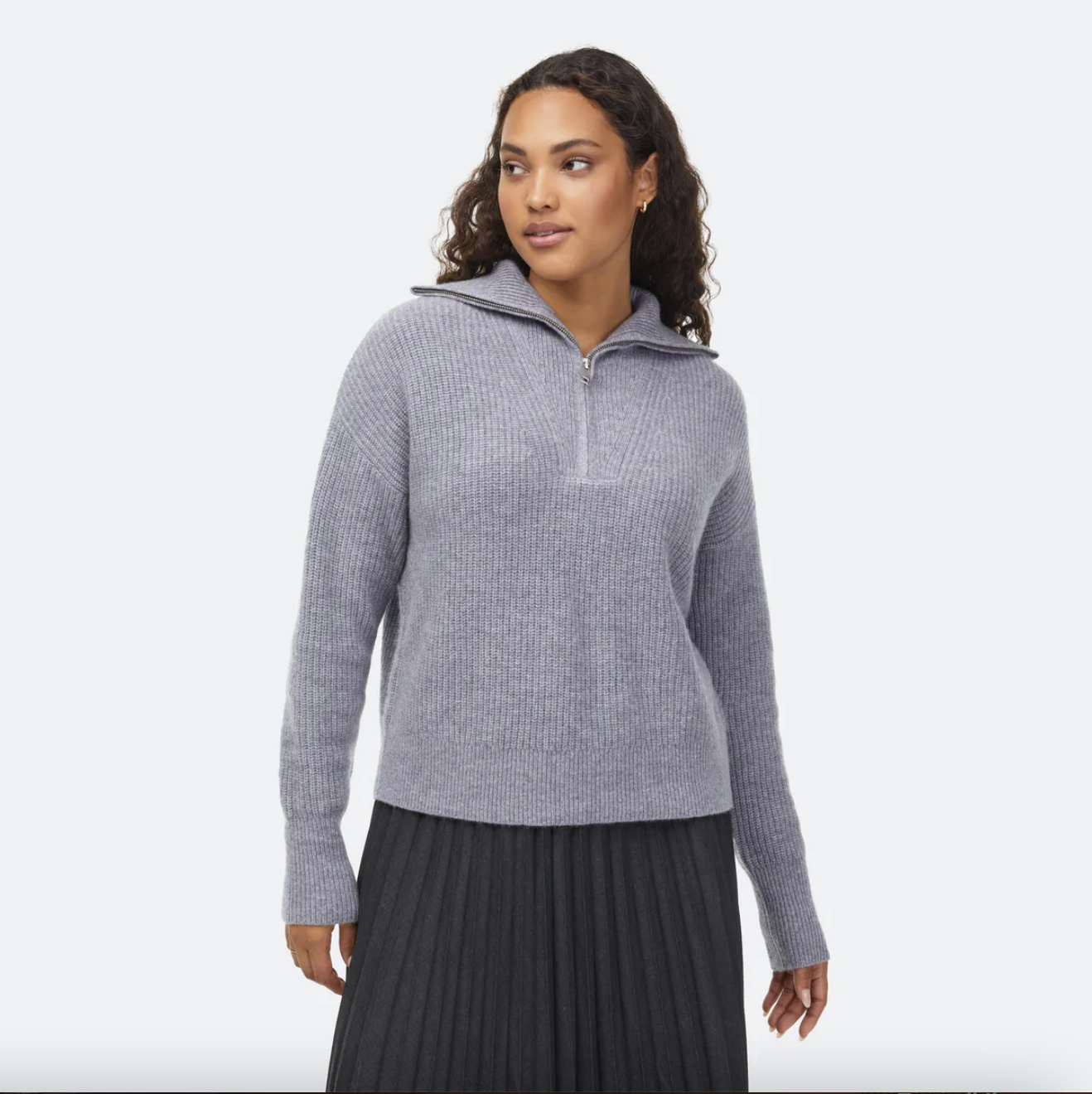 model wearing the grey ribbed quarter zip sweater