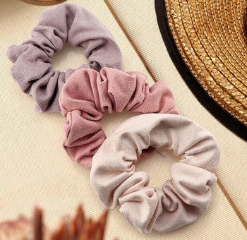 The set of pink and purple scrunchies