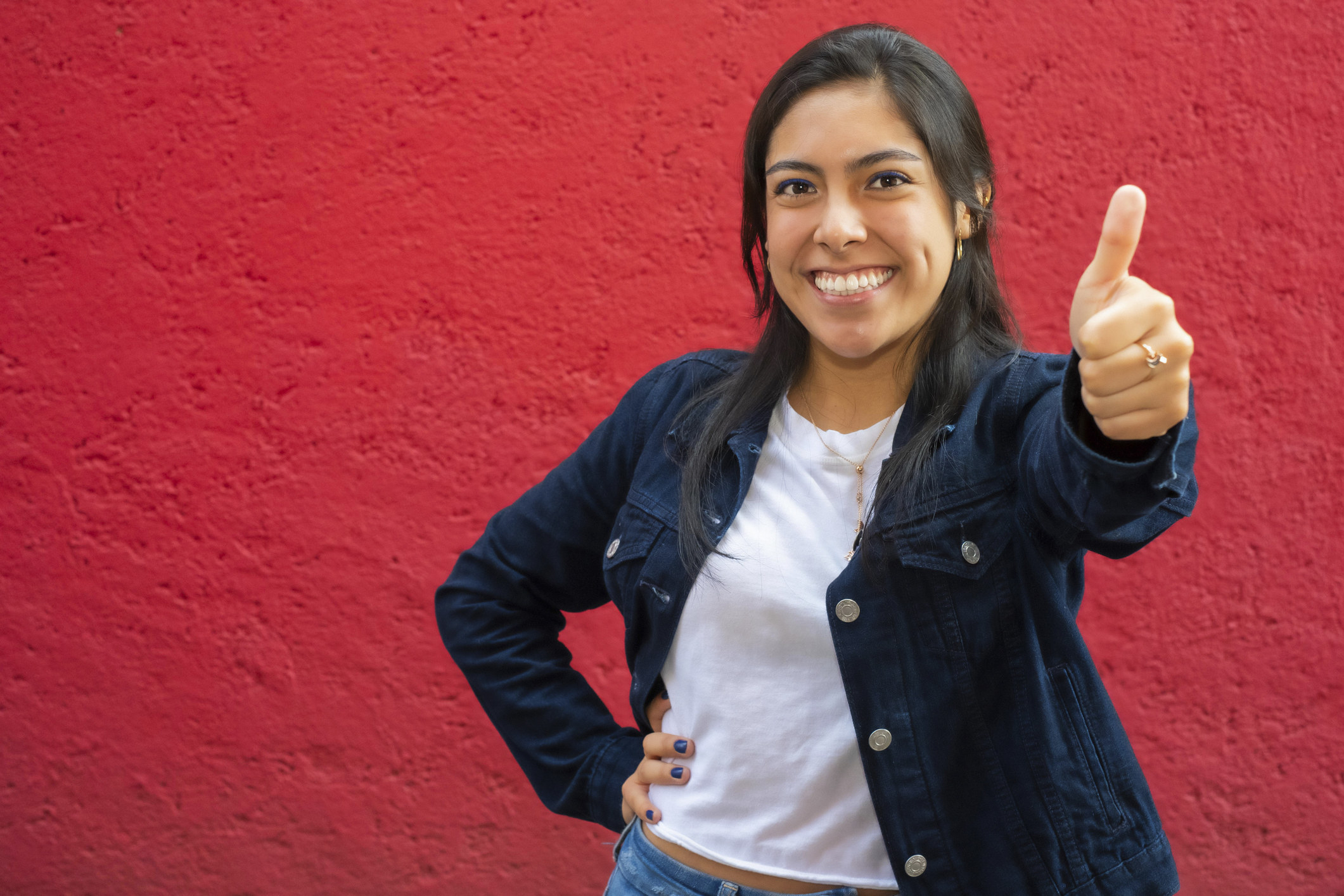 A woman giving the thumbs up