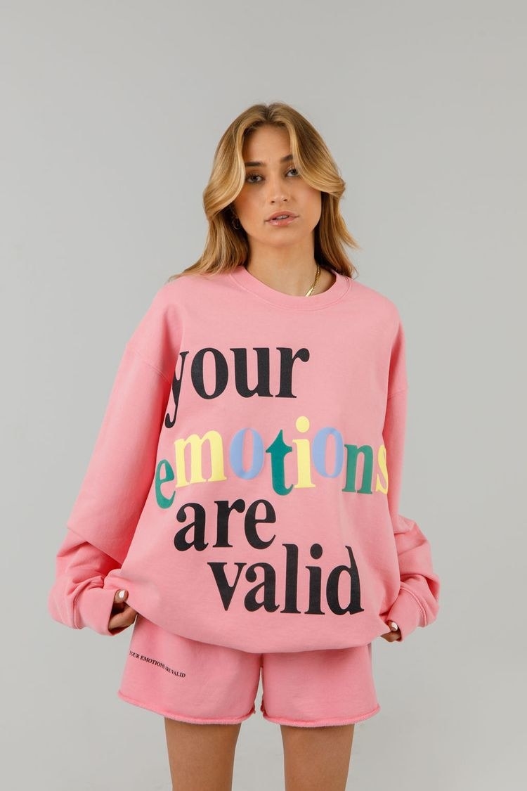 model wearing your emotions are valid crewneck