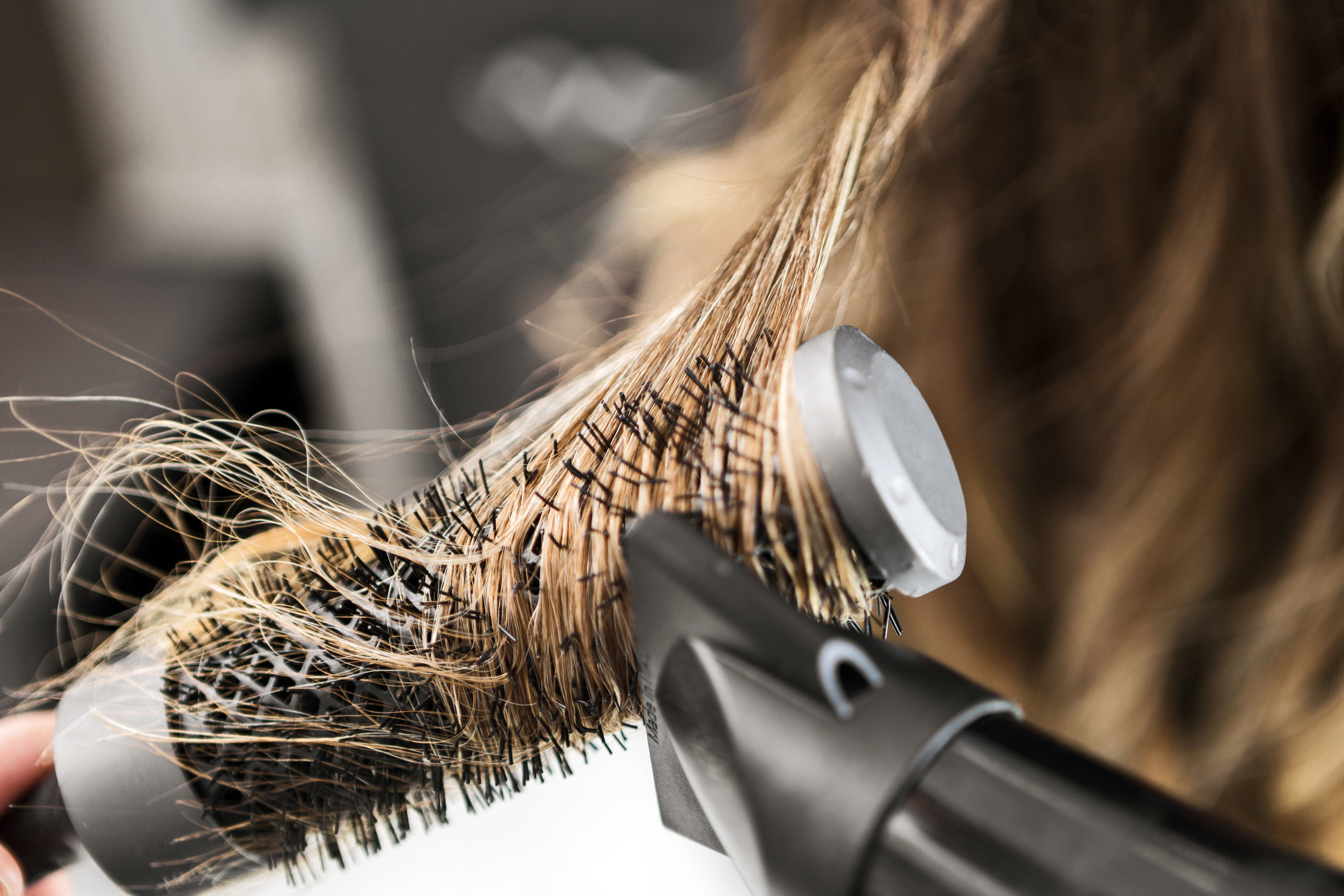 Hair on a round brush being blowdried