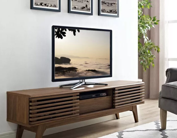 A wooden wide TV stand with grill style doors and middle shelf. Stands on 4 wooden legs. Comes in Walnut, Charcoal, White/Brown, and White. Can hold up to a 59&quot; TV