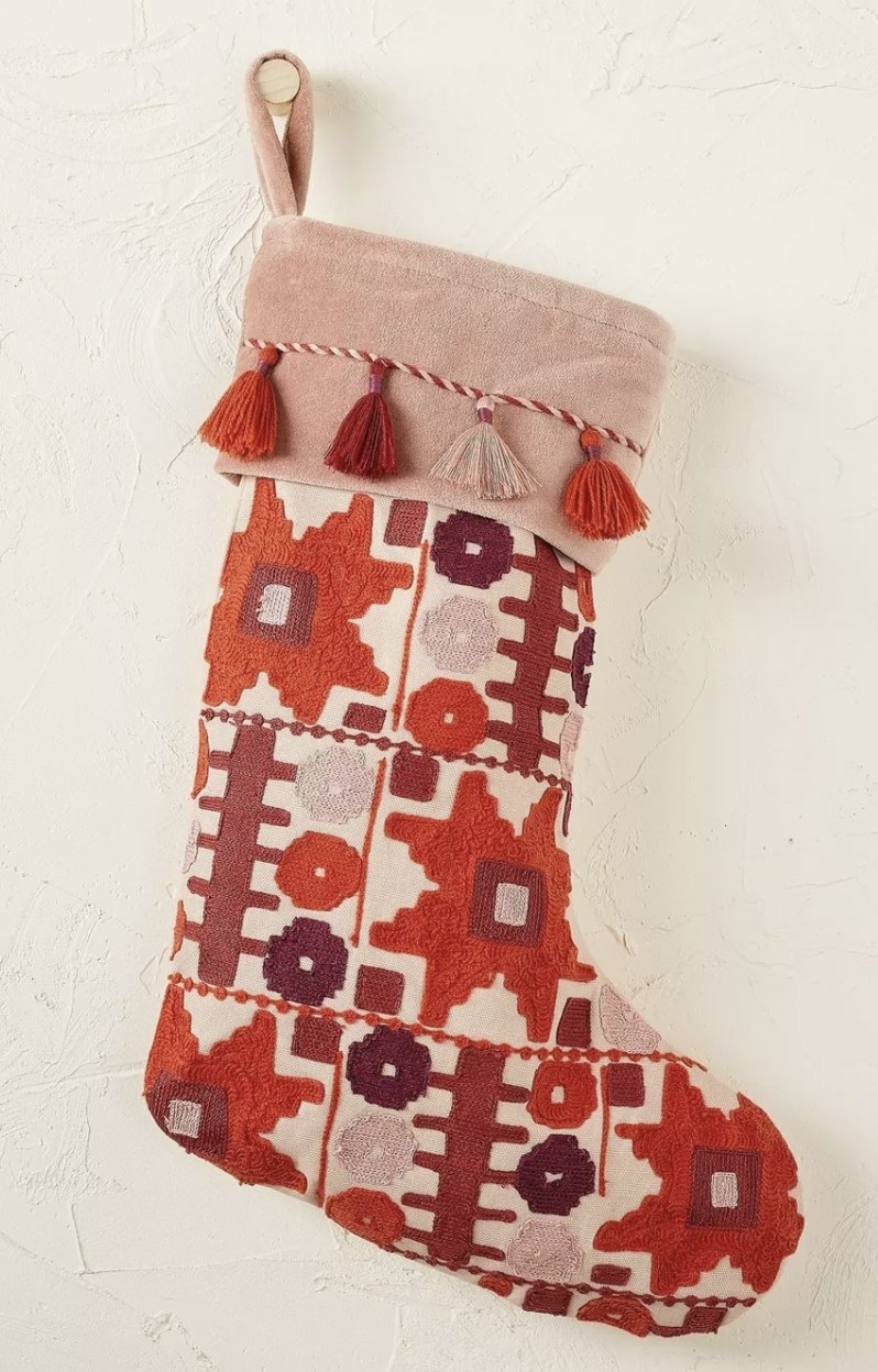 an embroidered stocking in red and pink