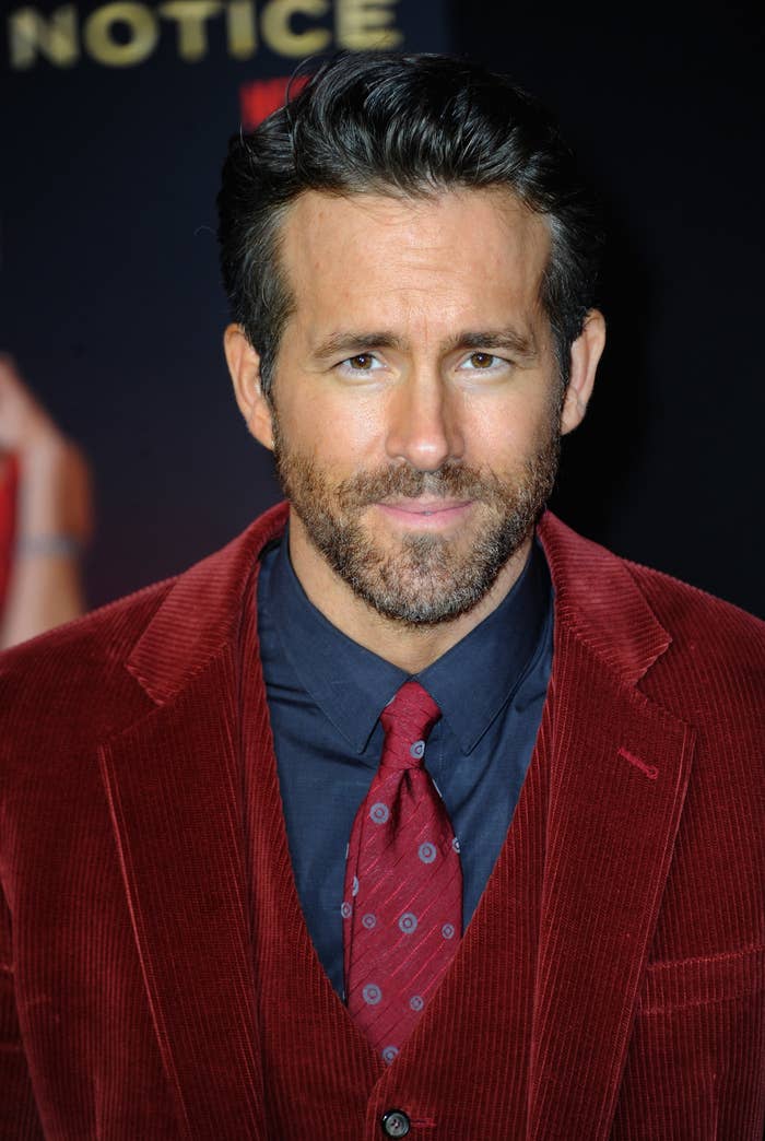 Reynolds wears a red suede jacket