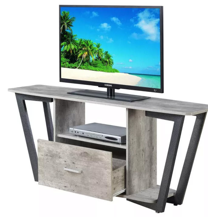 A graystone TV stand with unique legs that spread out and back into the top shelf. It has both open and closed storage and will bring so much character to any room.