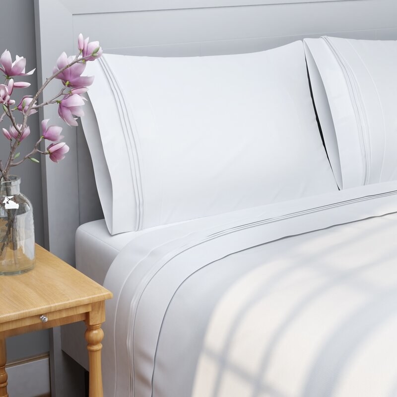 white Egyptian cotton sheet set on a bed