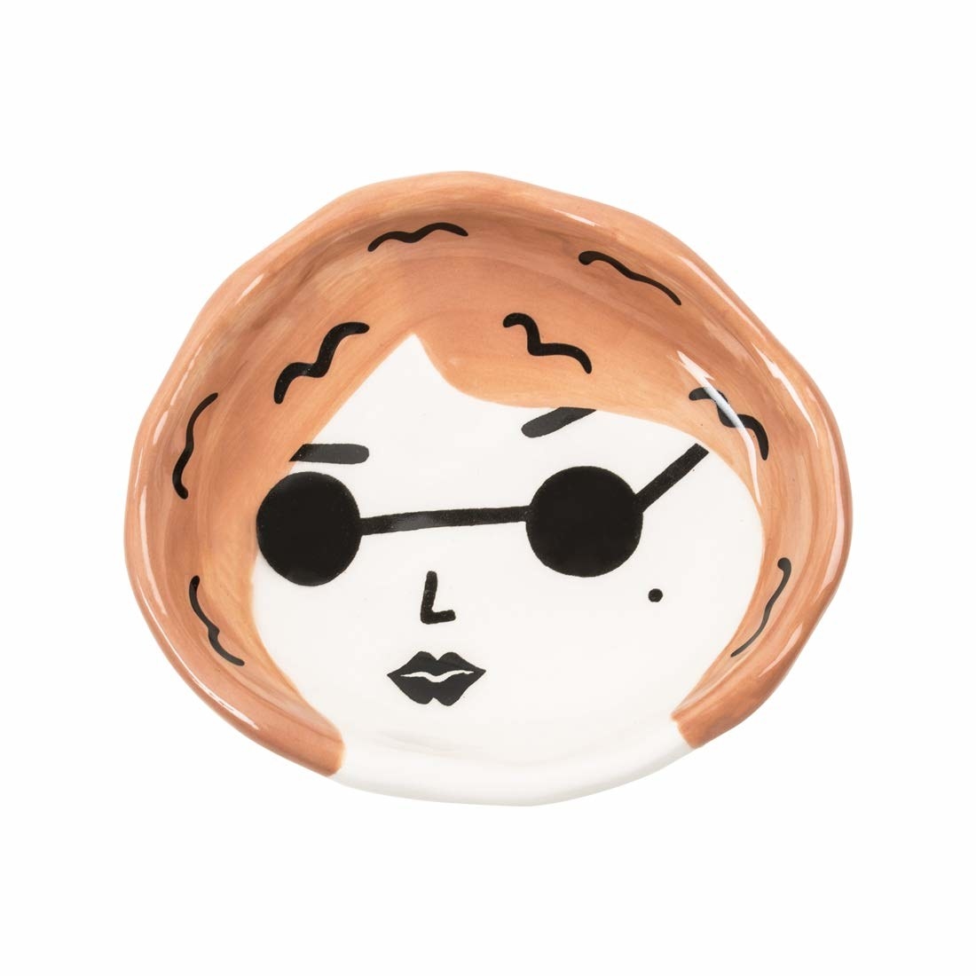 A trinket tray painted to look like a woman with short peach hair, and sunglasses. The illustration has a cartoonish, smug expression.