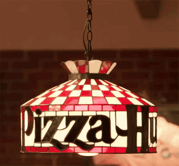 A GIF featuring a swinging Tiffany-style light, famously from Pizza Hut&#x27;s 1980s and 1990s decor