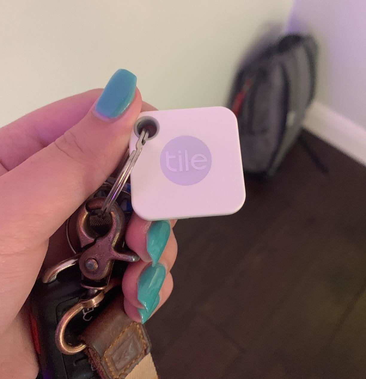 a reviewer shows their tile mate on a set of keys