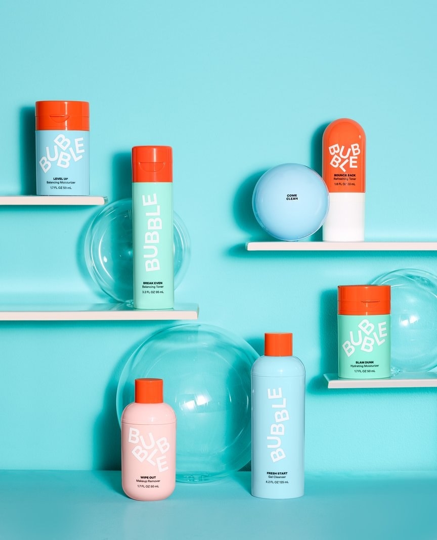 cute pastel bottles of skincare products, all with matching orange lids