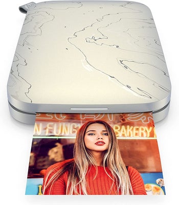 The portable printer printing out a photo