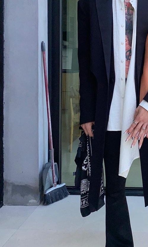a closeup on the broom that was int he back of the picture