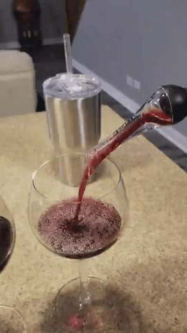 A gif of wine being poured through the aerator