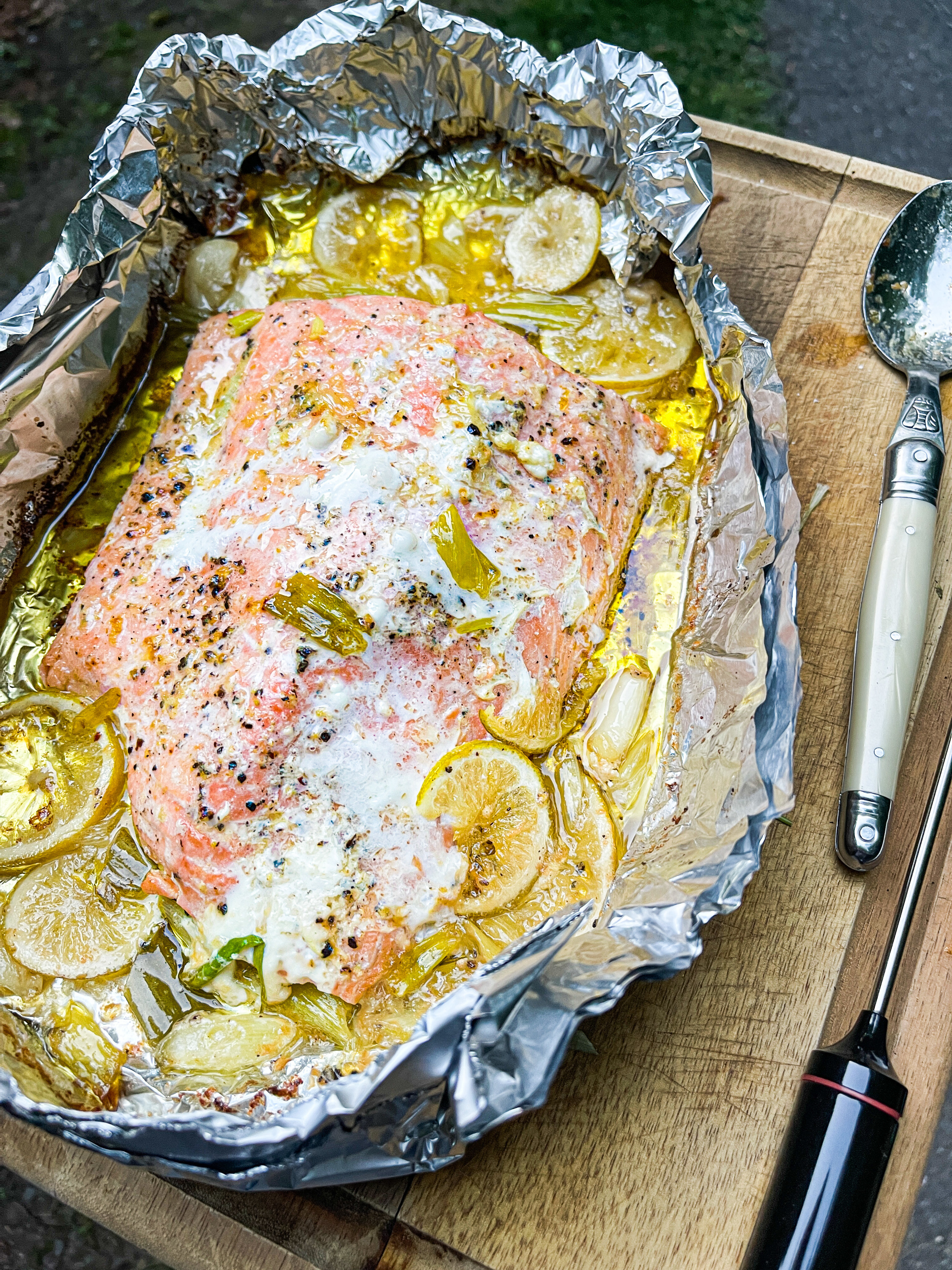 Salmon wrapped in foil, with olive oil all over it