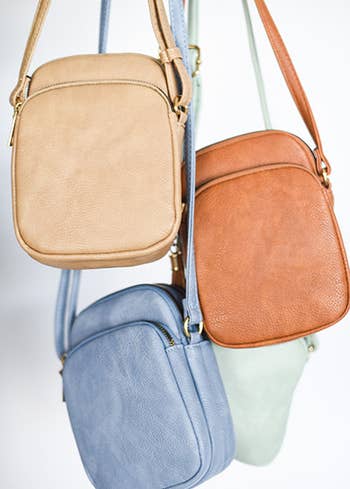 The beige, tan, blue, and green crossbody bags