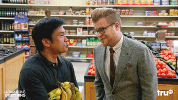 gif from &quot;adam ruins everything&quot; with man in supermarket emphatically squeezing banana