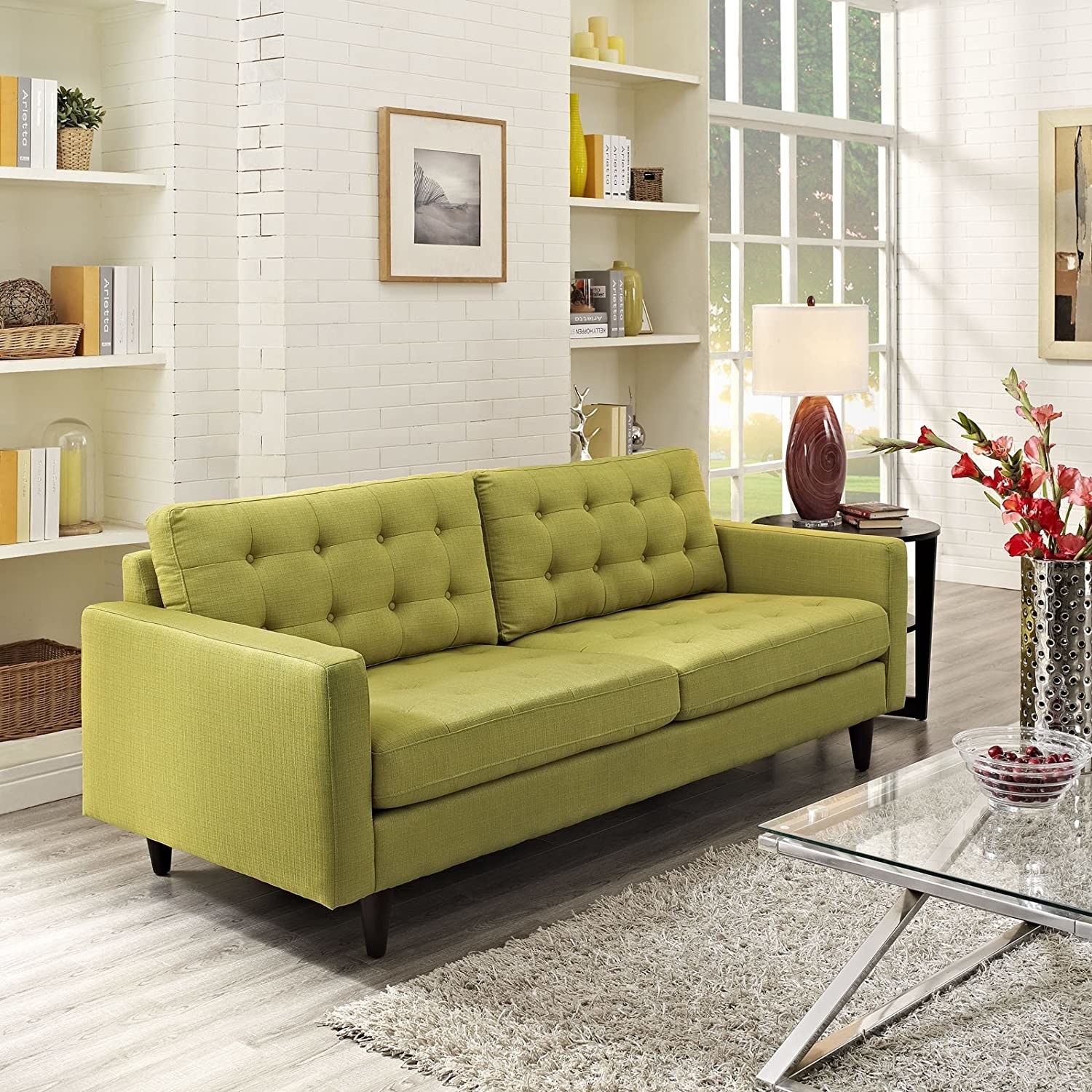 The tufted green sofa on display