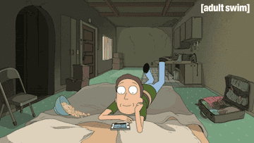 Jerry from Rick and Morty scrolling on his phone and eating popcorn on the bed