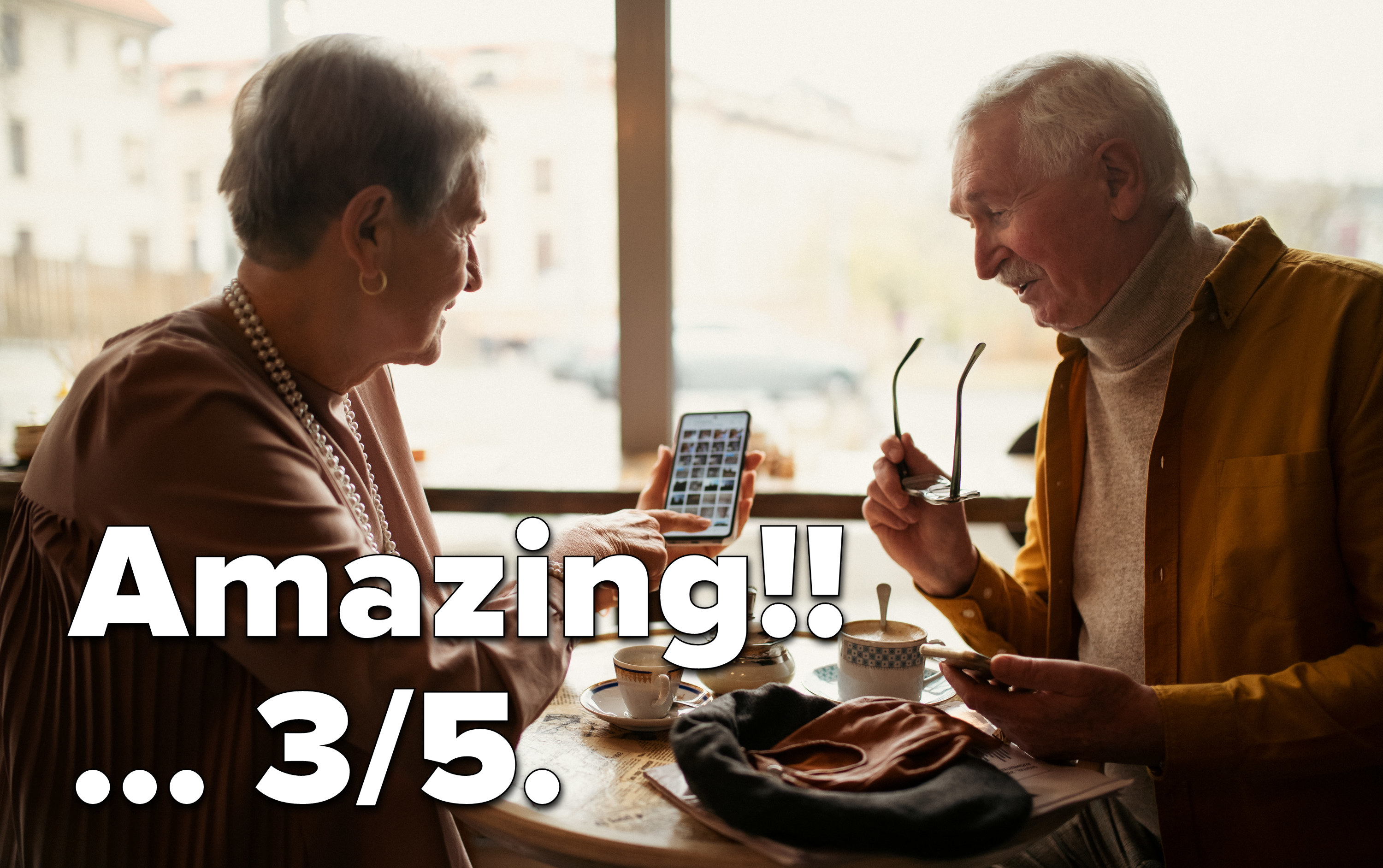 Older people on their phone in a cafe saying &quot;Amazing!! 3/5&quot;