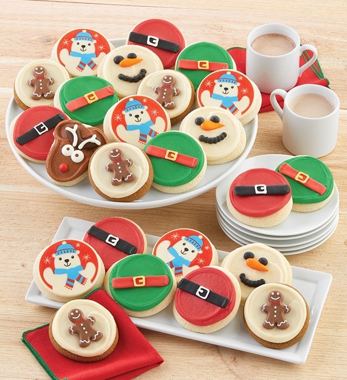 the cookies decorated with gingerbread men, snowmen, polar bears, reindeer, and santa and elf belts