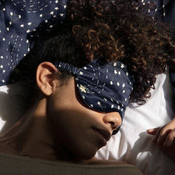 Model wearing the celestial eye mask while sleeping