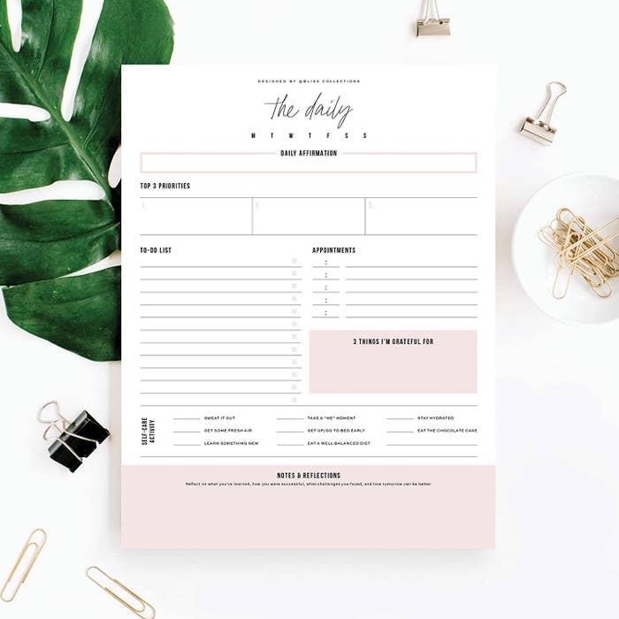A daily sticky note planner with sections for top tasks, appointments, and personal reflection.