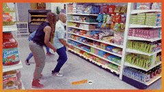 three people fighting for candy on a shelf in the show &quot;supermarket sweep&quot;