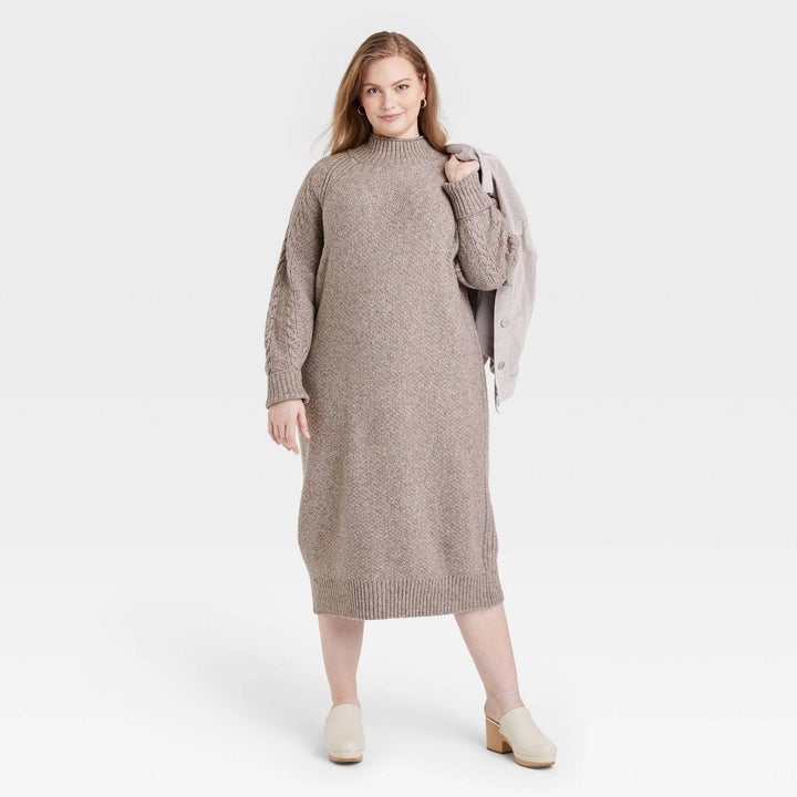 beige midi sweater dress with long sleeves with cables down them